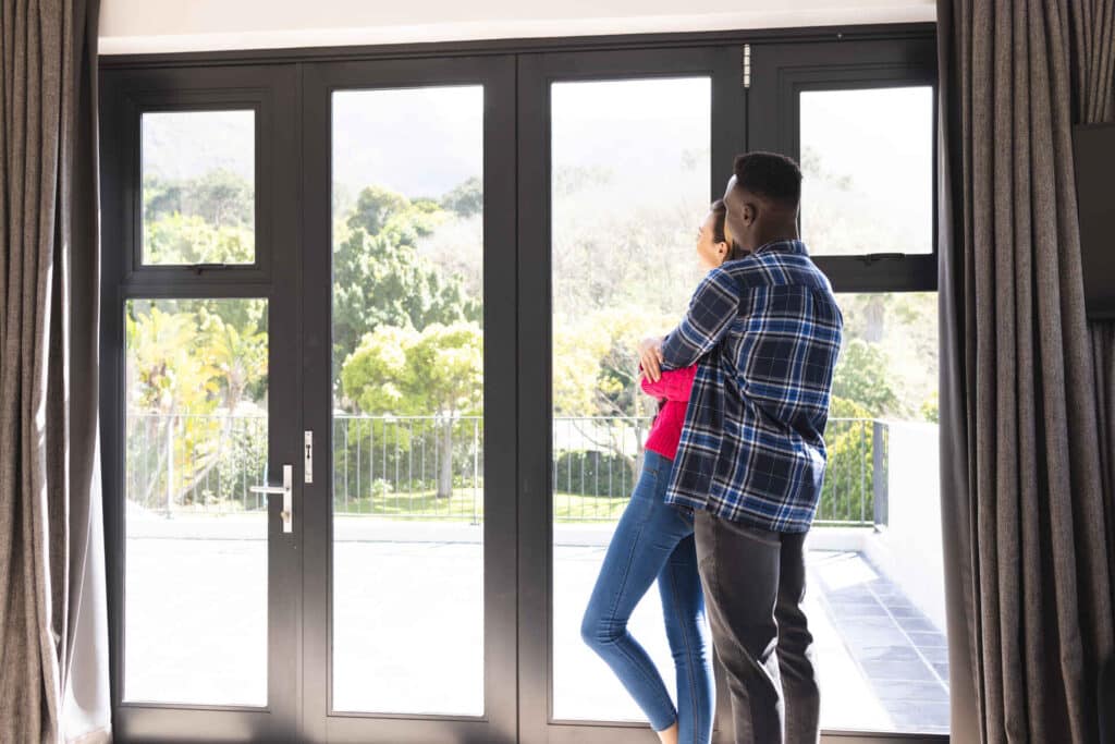 Couple enjoying tinted windows on their home in New Jersey